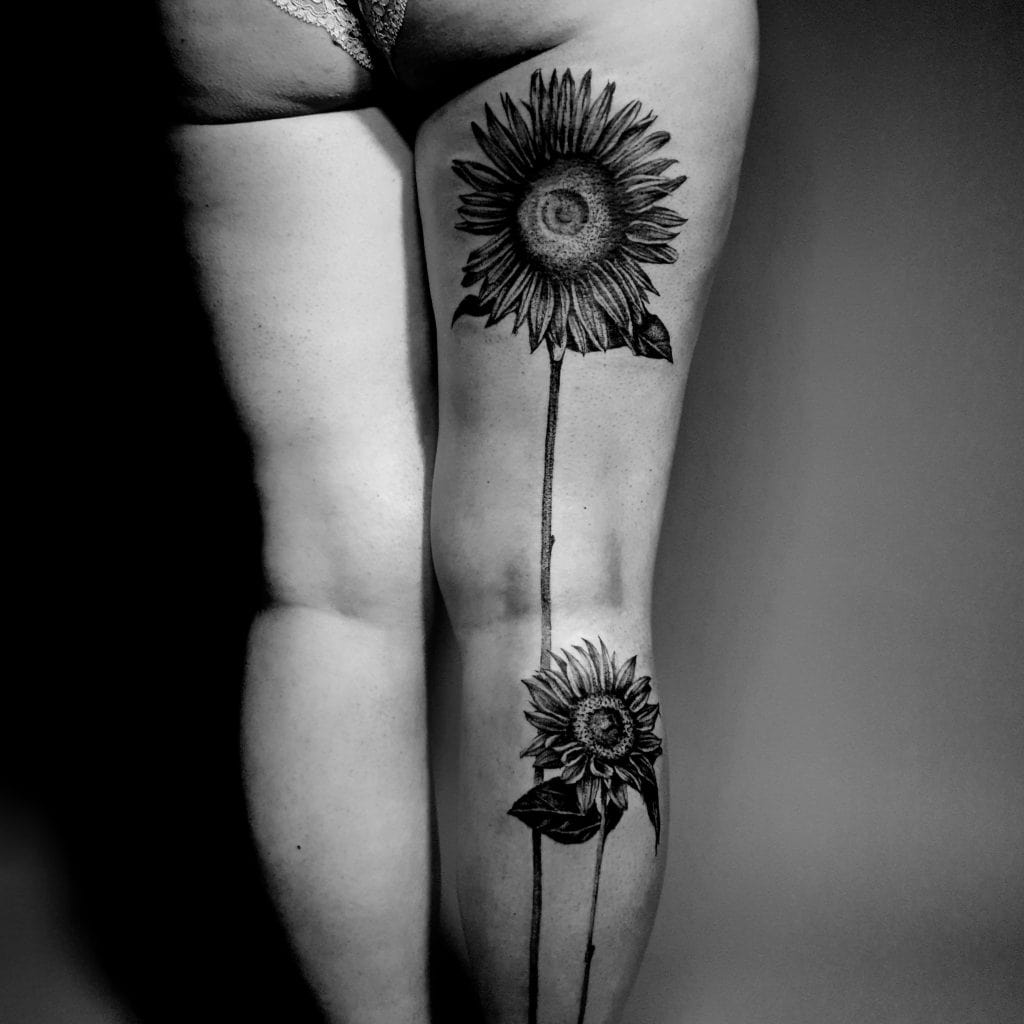 floral sunflower thigh tattoo