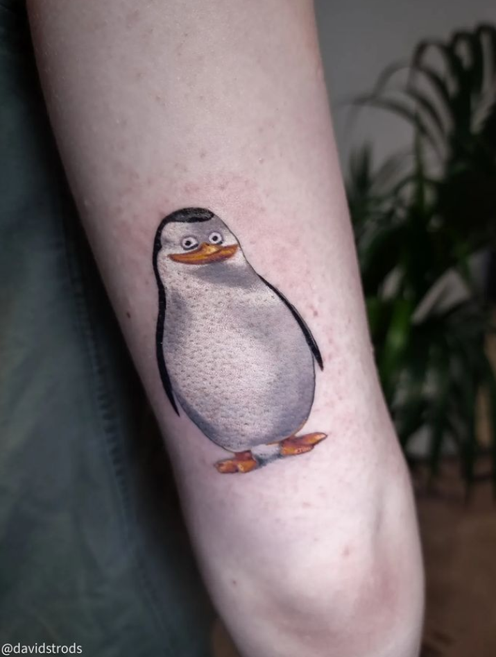 A close up photo of another penguin tattoo.